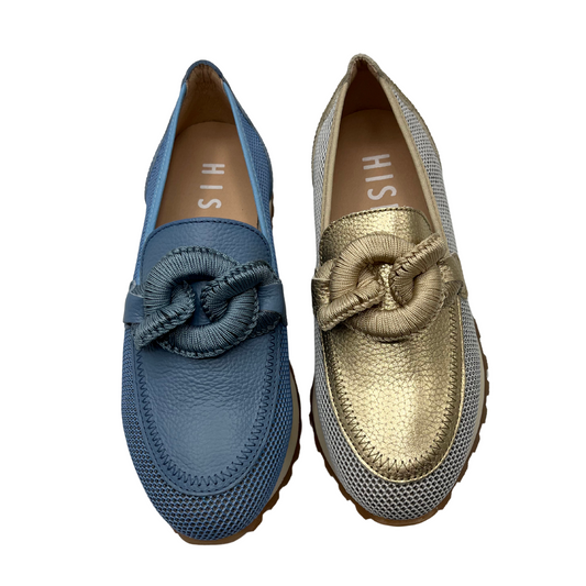 Top view of two loafers side by side. One is blue and the other is gold and white. Both have a circular chain detail on the toe box, mesh sides and leather lining.