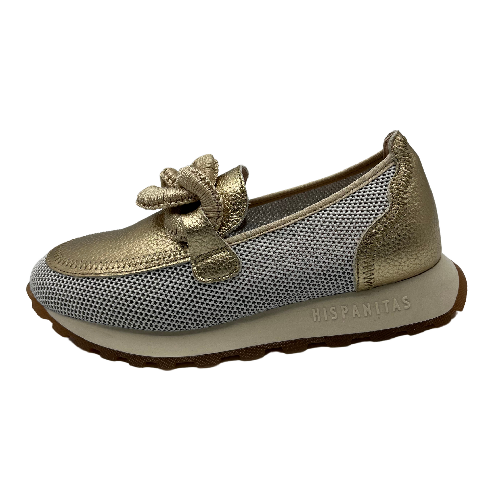 Left facing view of gold leather loafer with mesh sides, thick outsole and chain detail on upper.