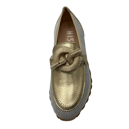 Top view of gold leather loafer with mesh sides, thick outsole and chain detail on upper.