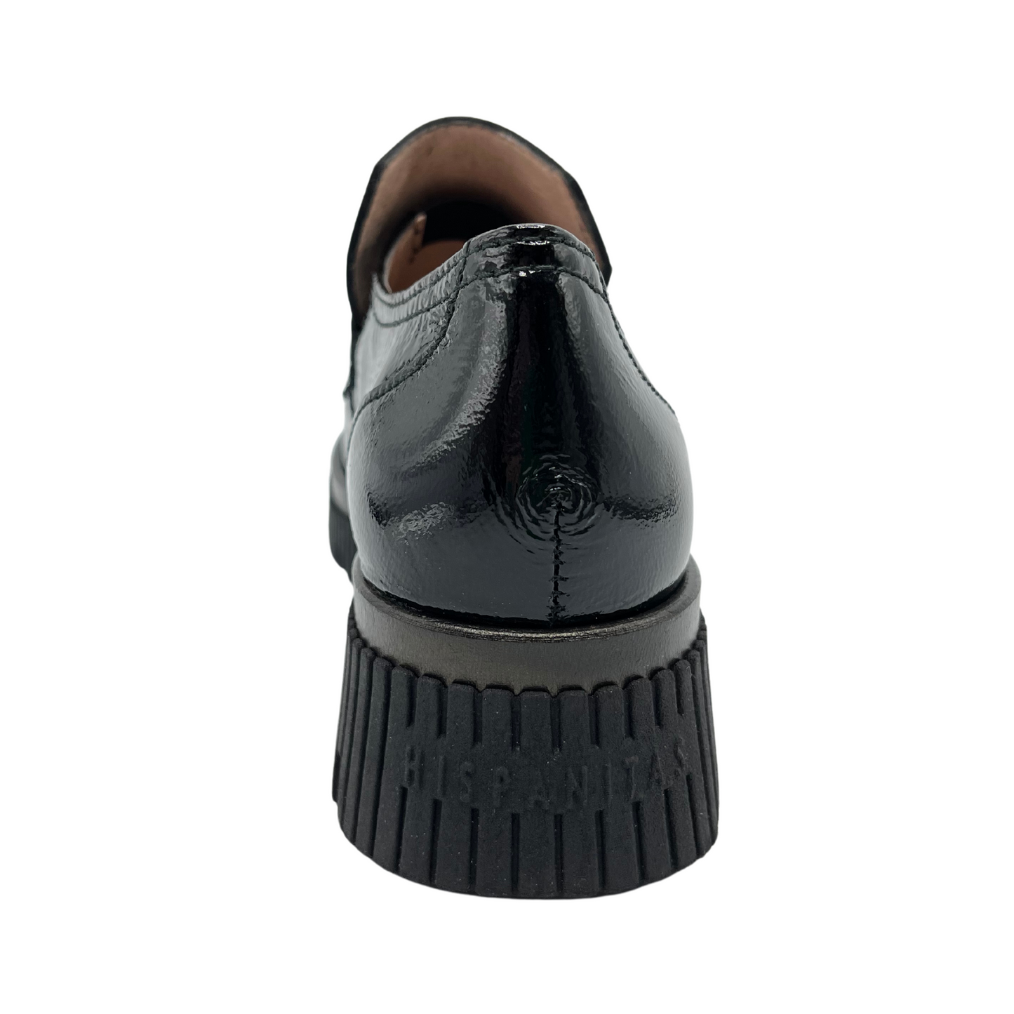 Back view of a black patent leather derby shoe with a rounded toe and platformed track heel