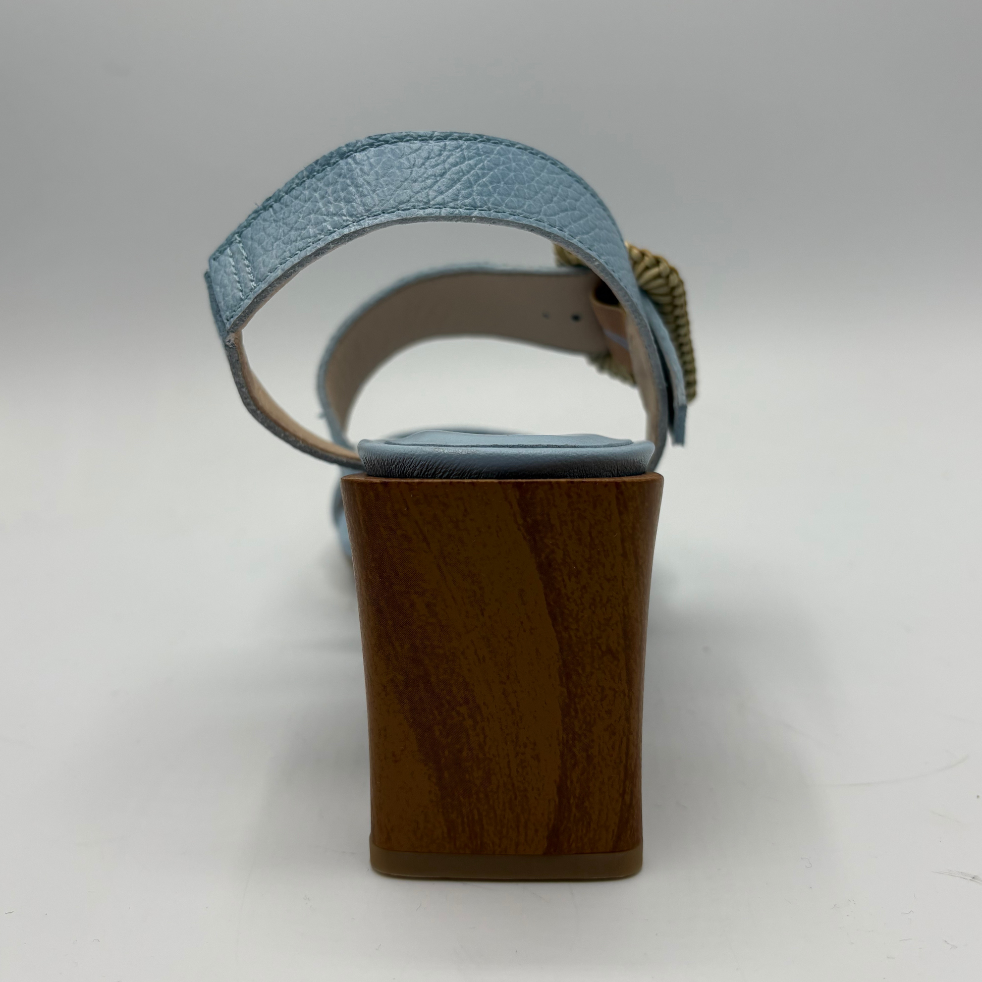 Blue sandal with wooden block heel on a white background