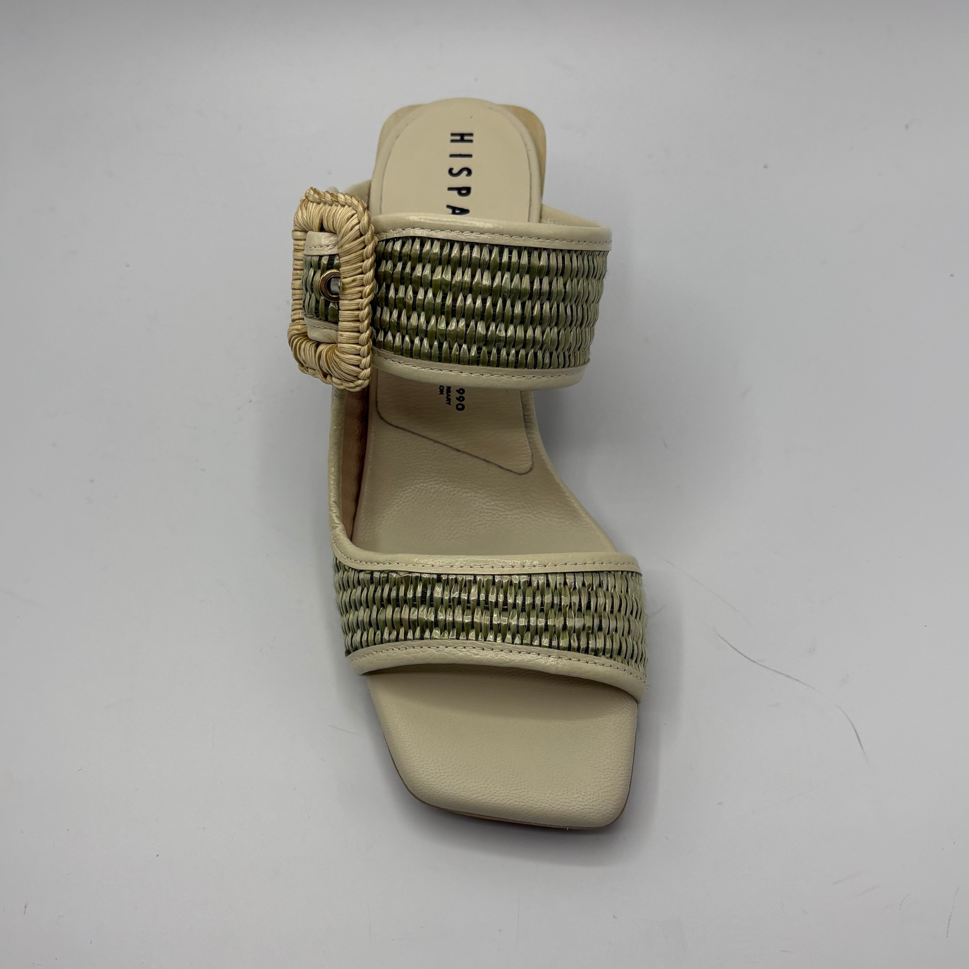 Beige sandal with woven strap on a white background