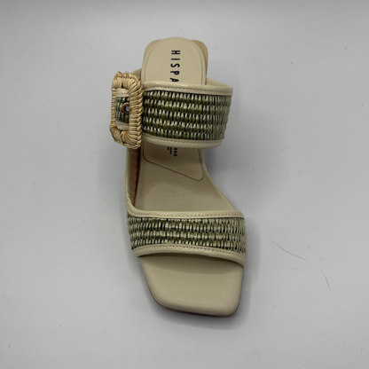 Beige sandal with woven strap on a white background