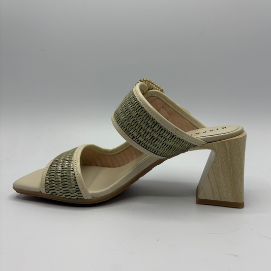 Beige sandal with woven strap and wooden heel on a gray background