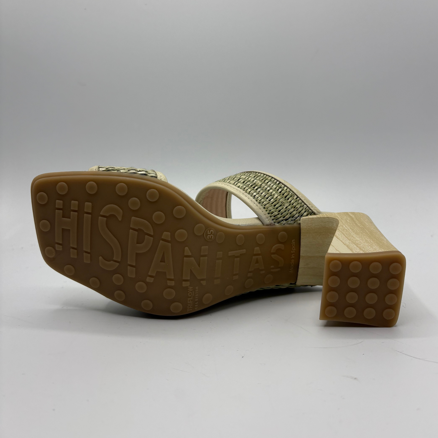 Back view of a sandal with 'Hispanitas' branding on a gray background