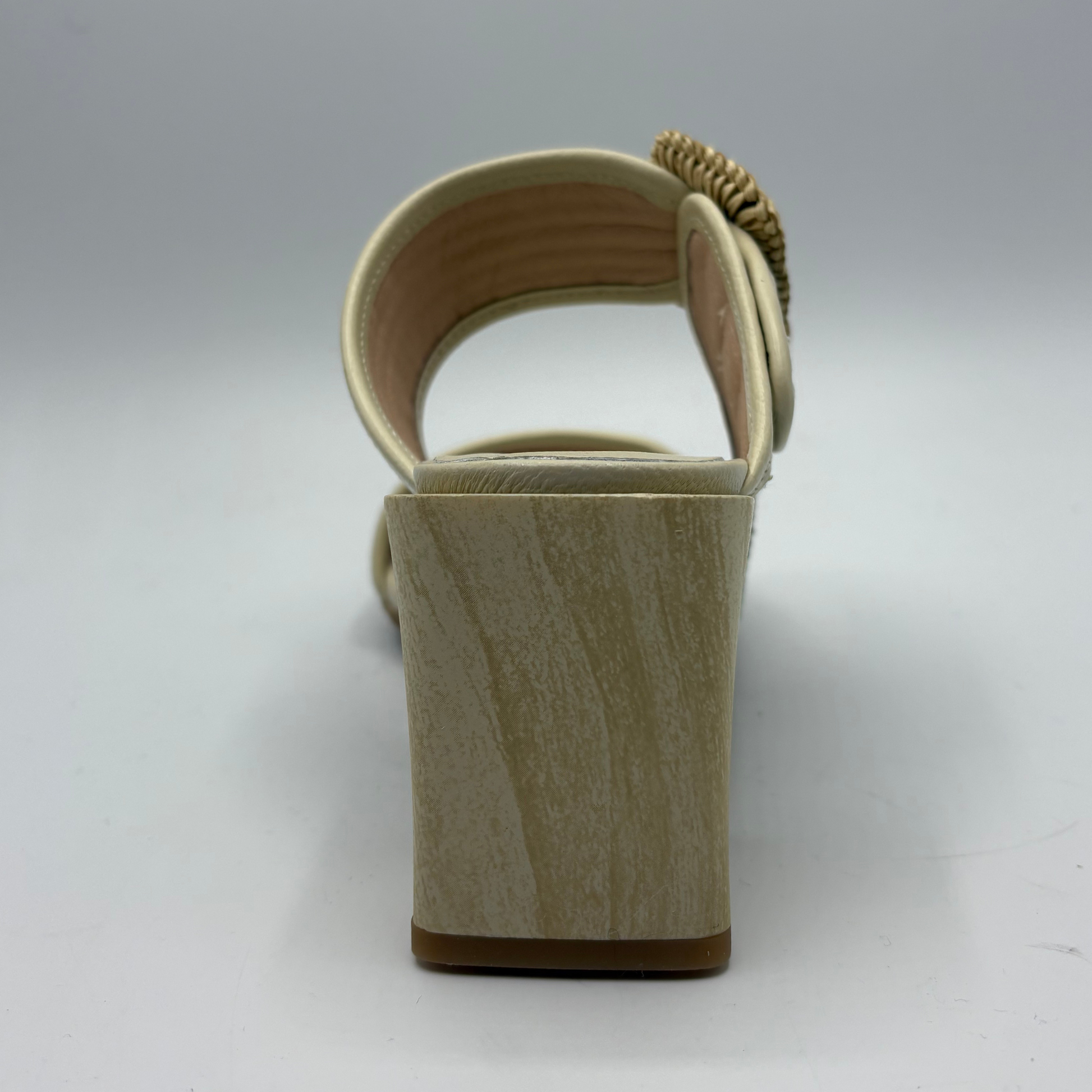 Beige sandal with a block heel on a white background