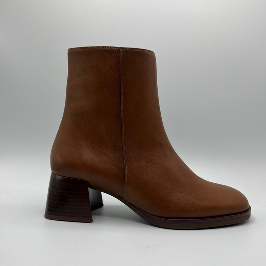 Brown ankle boot on a light gray background