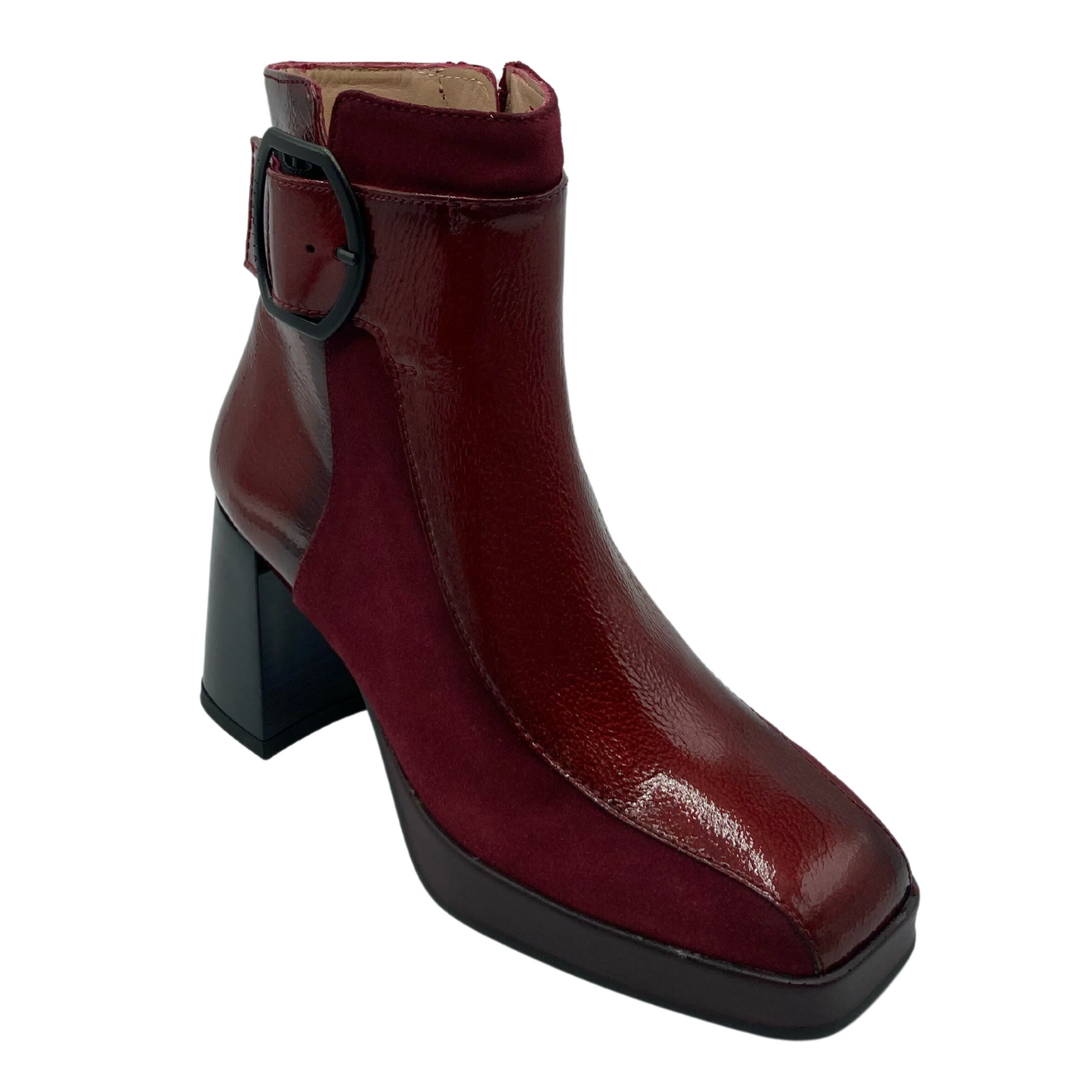 Angled view of chunky heeled leather boot with square toe