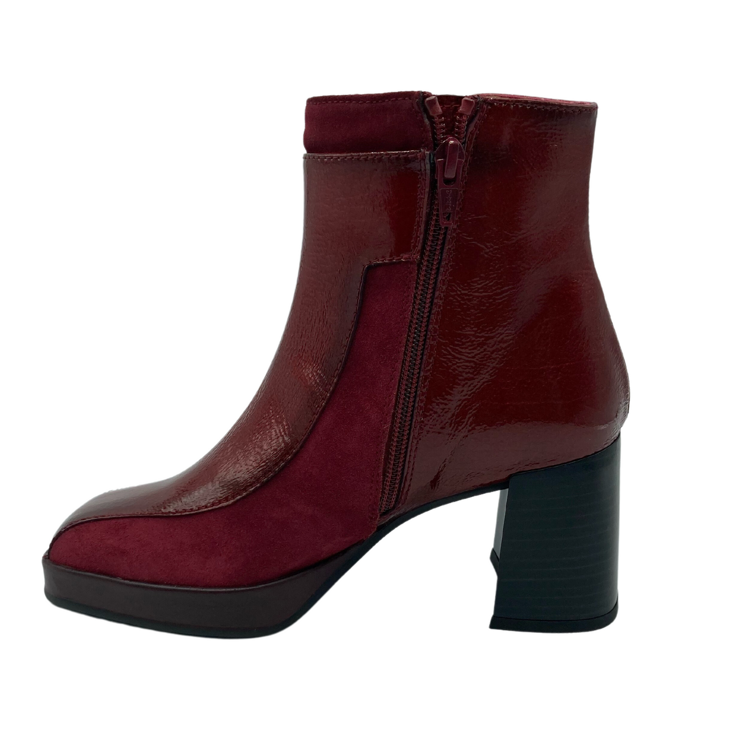 Left facing view of red leather short boot with red zipper closure