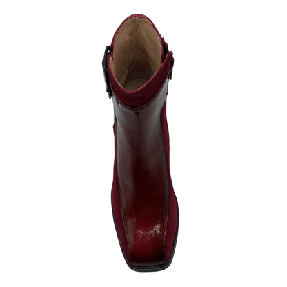 Top down view of red leather boot with cream coloured leather inner lining