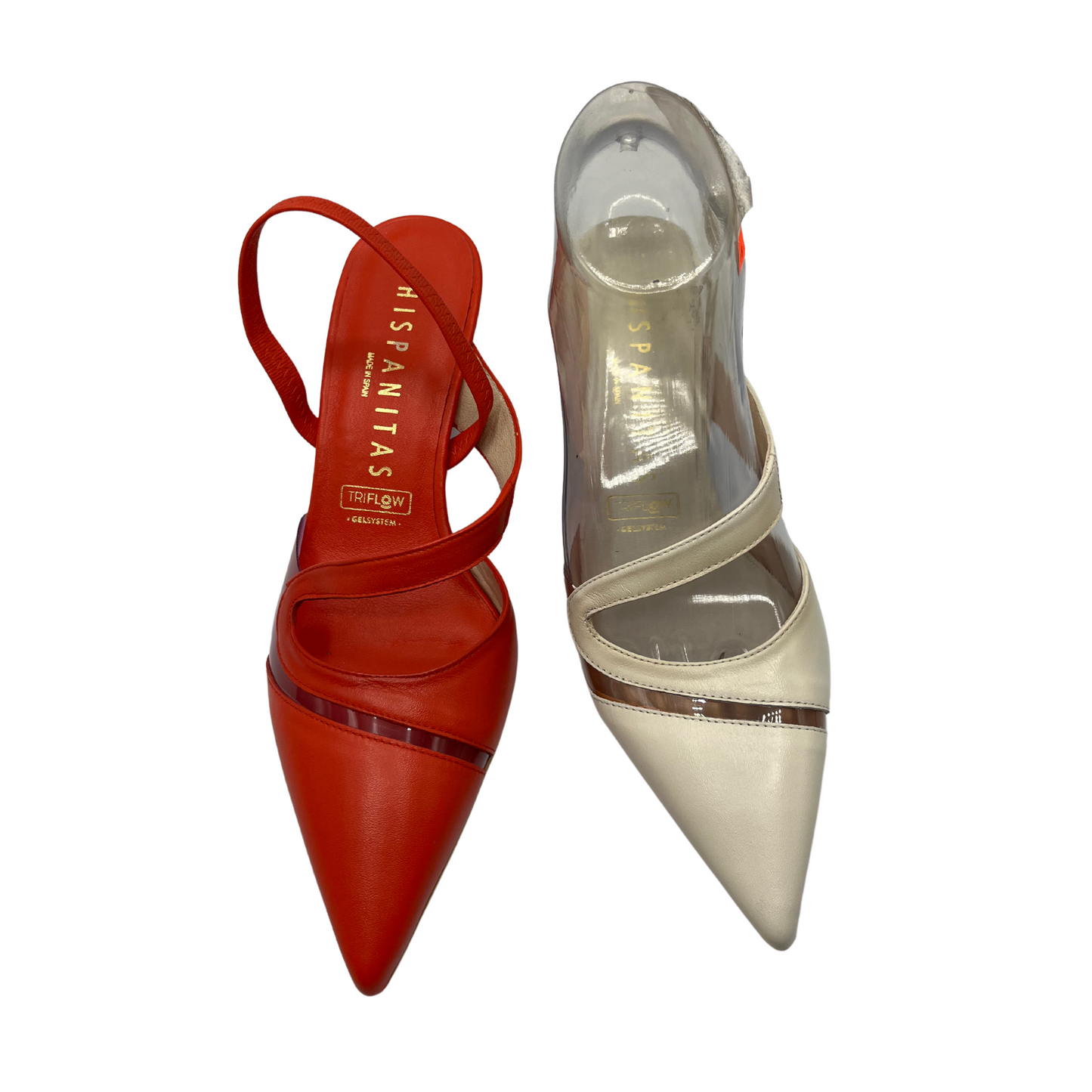 Top view of one red shoe and one cream shoe. Both have a pointed toe, a slingback strap and clear vinyl details.