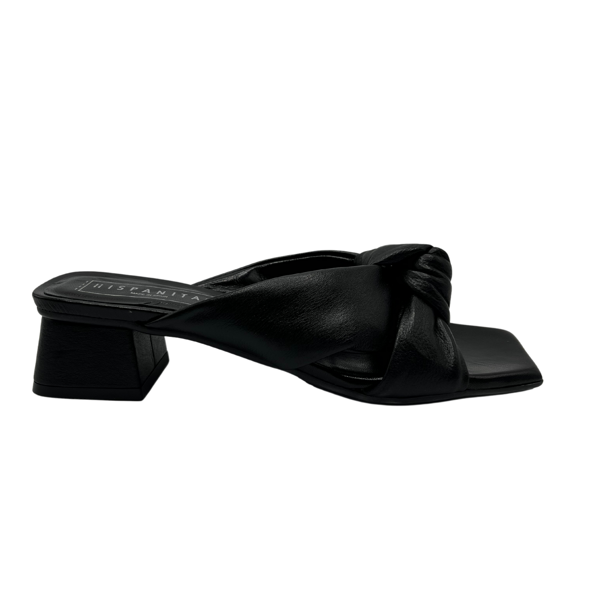 Right facing view of all leather mule sandal with wrapped 1 inch heel and knot detail on strap