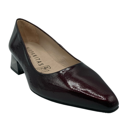 45 degree angled view of wine patent leather pointed toe pump with block heel