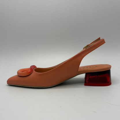Orange slingback shoe with red translucent heel on a white background