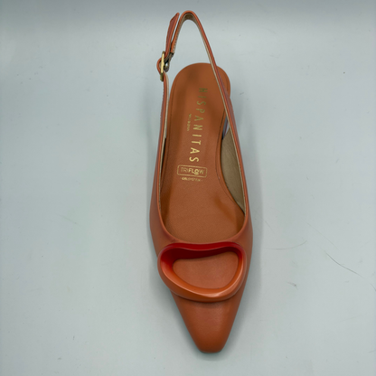 Orange high-heeled shoe with slingback design on a gray background