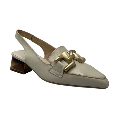 45 degree angled view of white leather pump with matte gold detail on upper and short block heel
