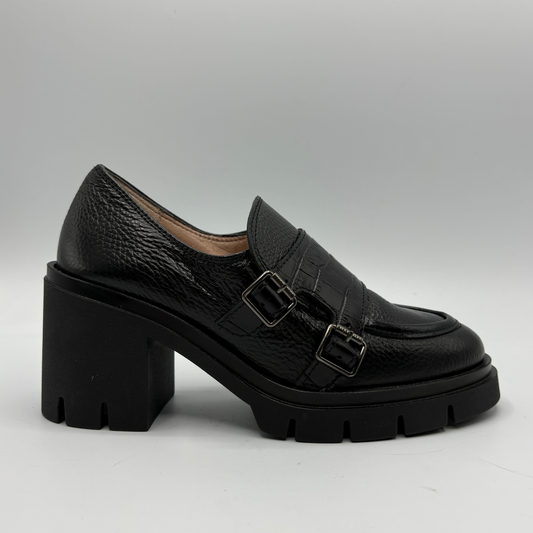 Right facing view of a black leather loafer with a chunky heel.
