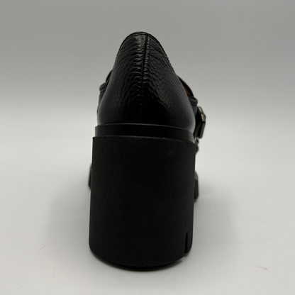 Back view of a black leather loafer with a chunky heel.