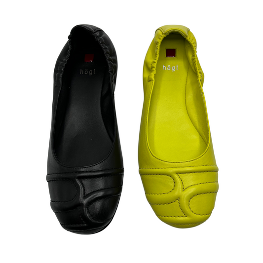 Top view of two ballet flats. One is black and one is lime green. Both are leather with an elasticated back