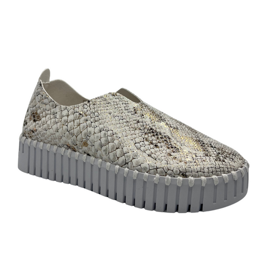 45 degree angled view of leather snake print sneaker with platform white rubber outsole
