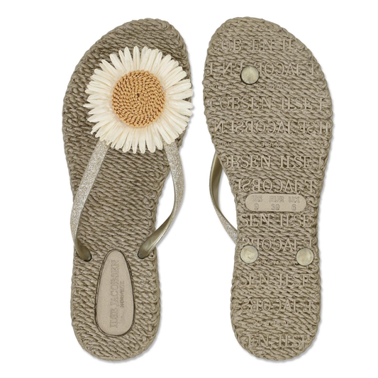 Pair of sandals with a flower design on a white background