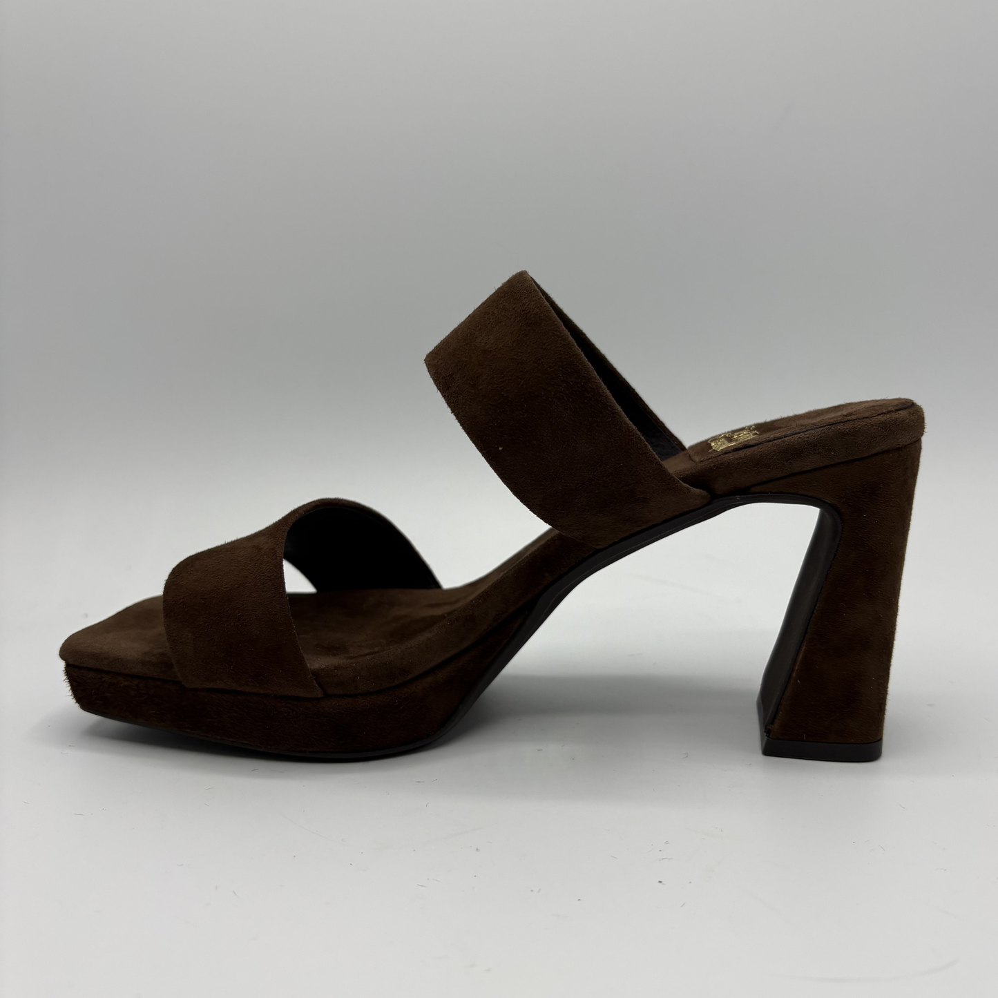 Brown suede sandal on a gray background