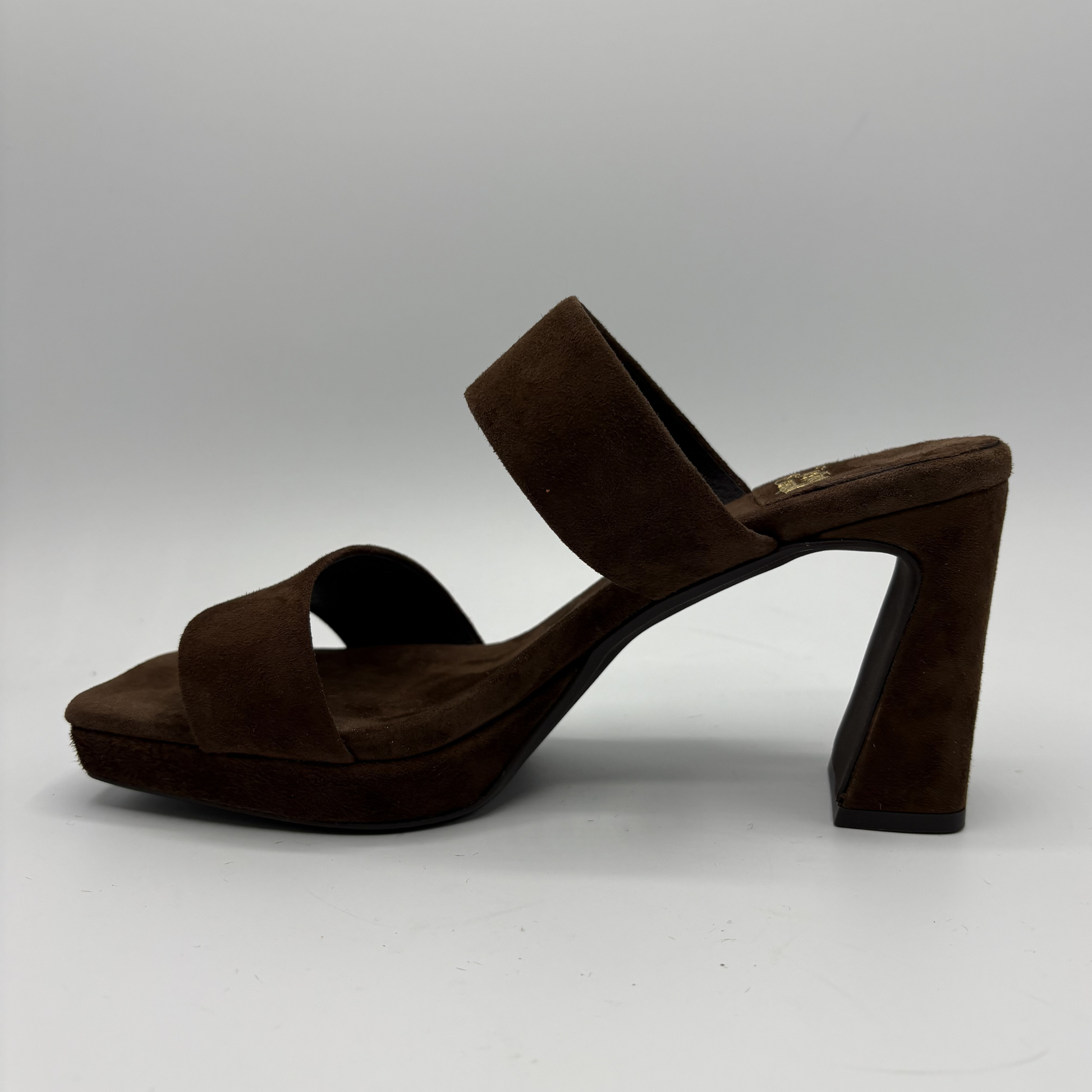 Brown suede sandal on a gray background