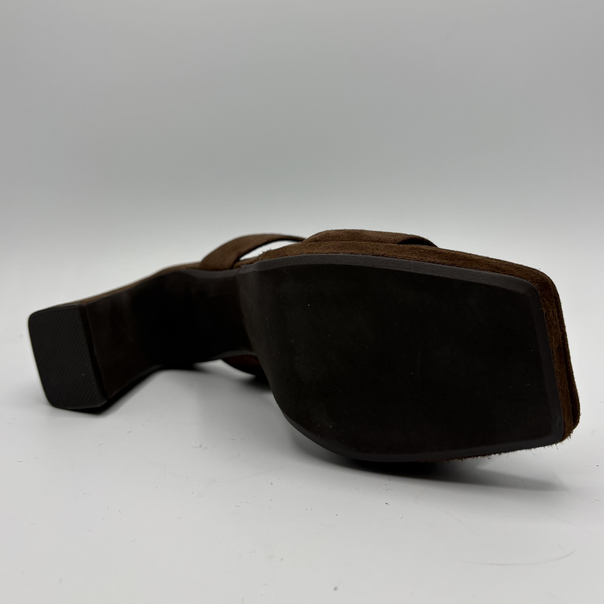 Brown leather belt on a white background