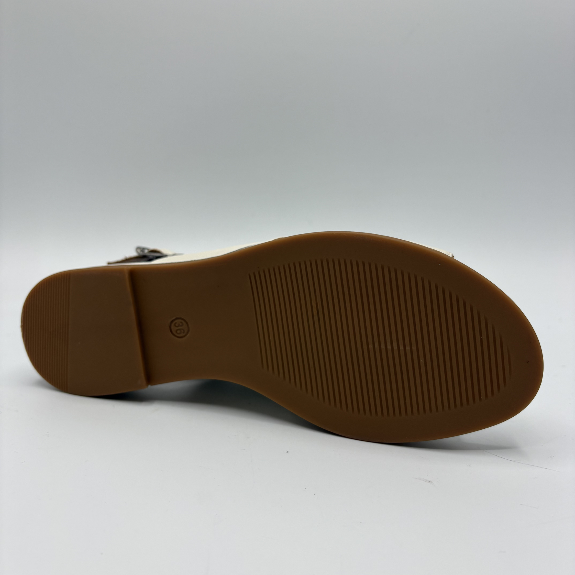 Brown sole of a shoe on a white background