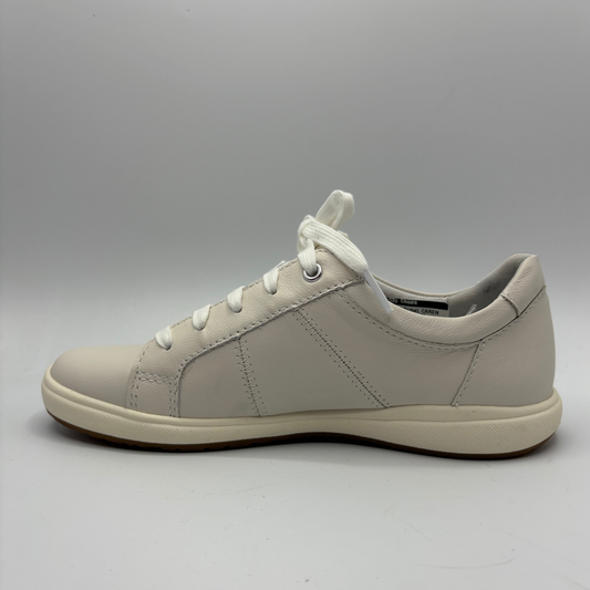 Beige sneaker on a gray background