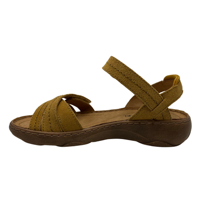 Left facing view of tan leather suede sandal with multiple adjustable straps and open toe