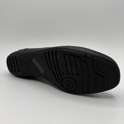 Black shoe sole on a light gray background