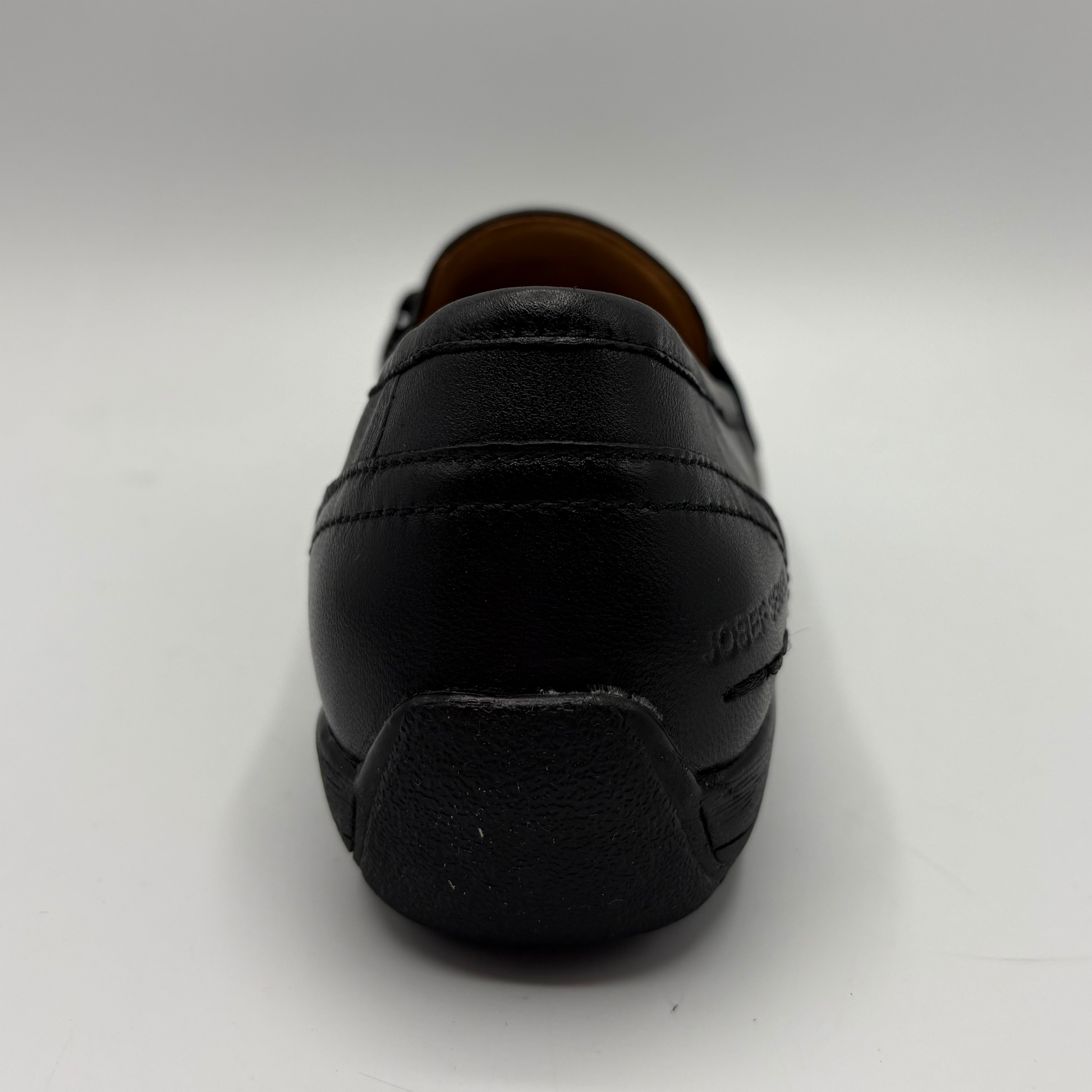 Black loafer shoe on a white background
