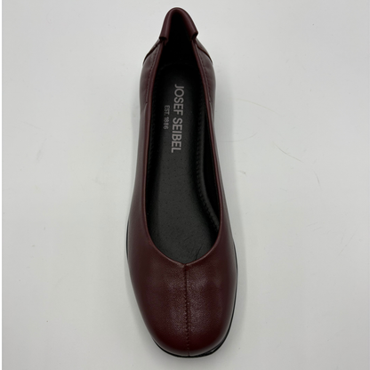 A single dark burgundy leather flat shoe shown from a top-down view on a light gray background. The brand name 'JOSEF SEIBEL' is printed in white on the black insole.
