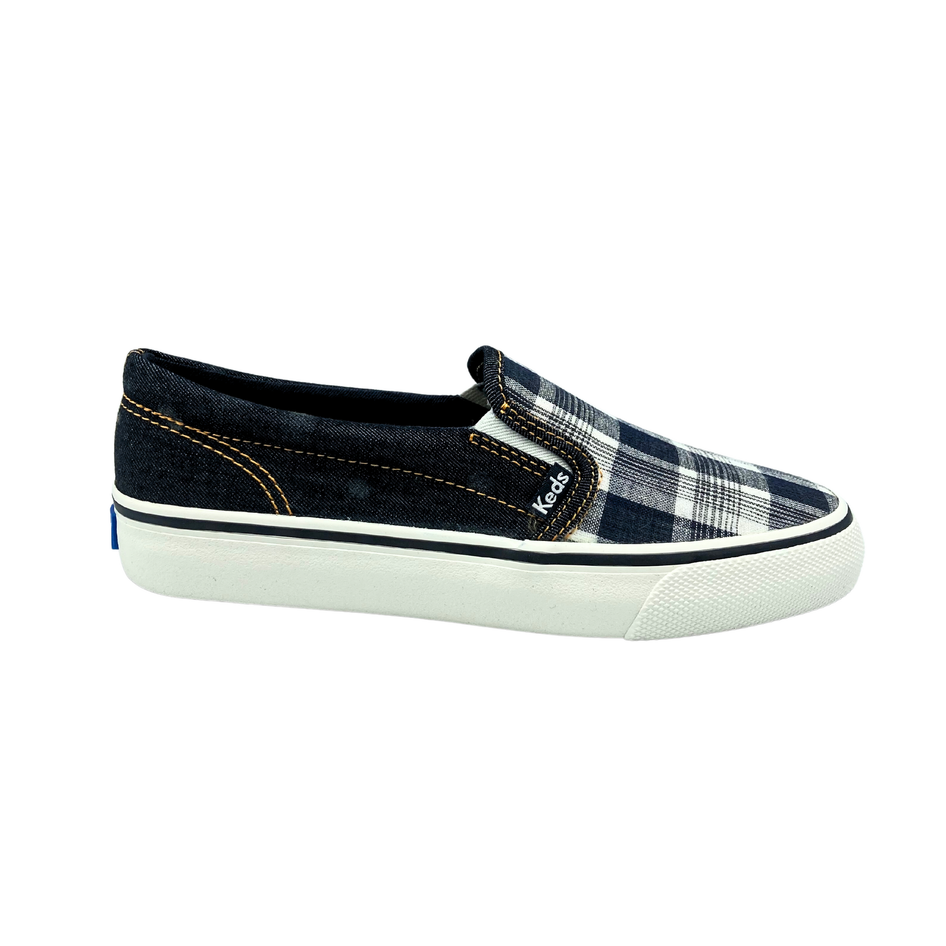 Outside view of a canvas slip on sneaker in a black plaid colorway.  Black plaid on top of foot.  Sides and back are in the black denim.  Outsole is white rubber with a black stripe around the top