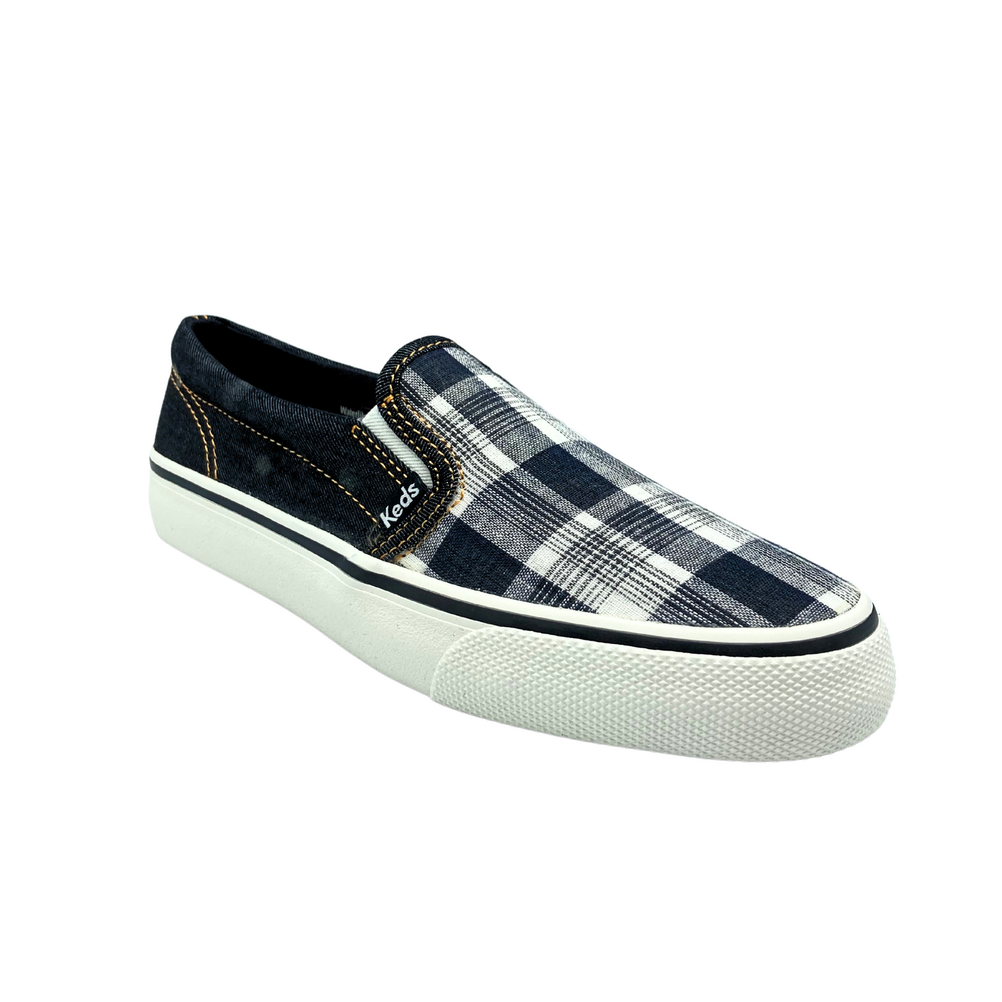 Angled front view of a slip on canvas sneaker in a black denim plaid.  Rubber outsole is white with a black stripe around the top