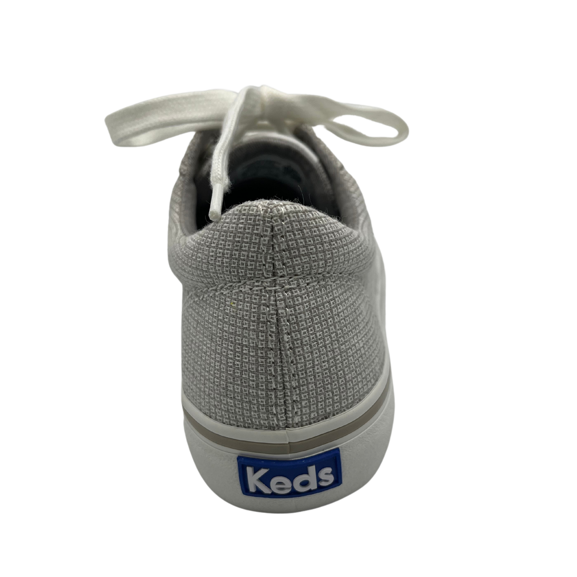 Back view of grey check canvas sneaker with white rubber outsole, white laces and padded collar
