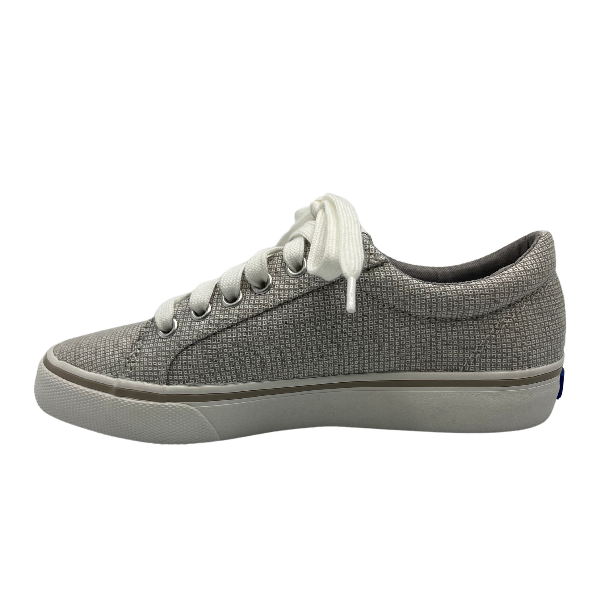 Left facing view of grey check canvas sneaker with white rubber outsole, white laces and padded collar
