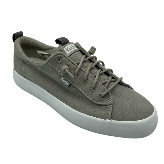 Angled view of snealer in grey canvas with white rubber sole, grey eyelets and grey laces