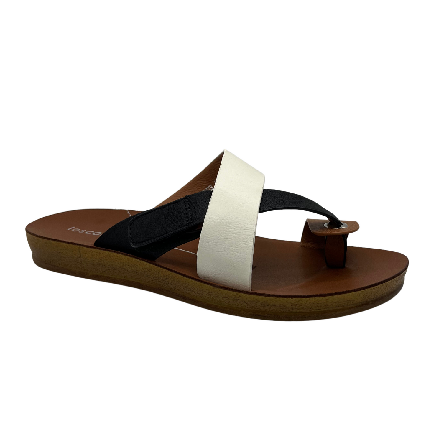45 degree angled view of black and white strapped sandal with toe strap and velcro closure