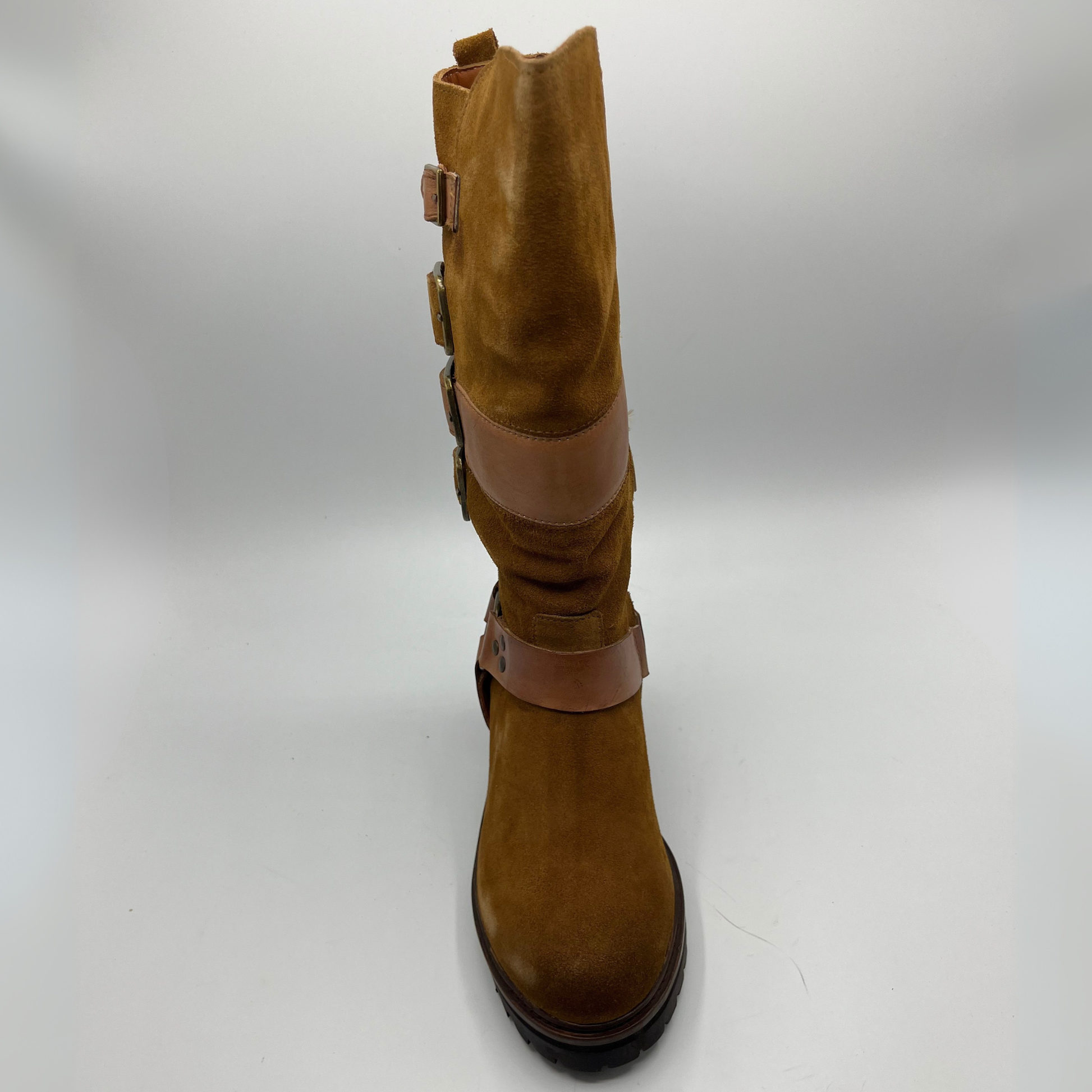 Brown boot with multiple straps on a white background