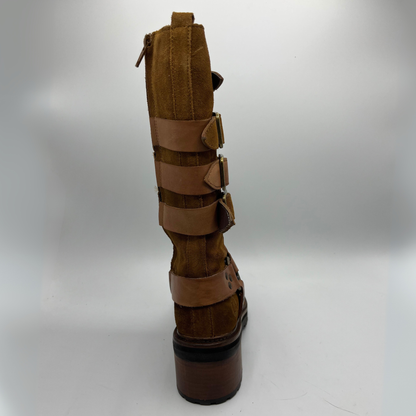 Brown leather boot with multiple straps on a white background