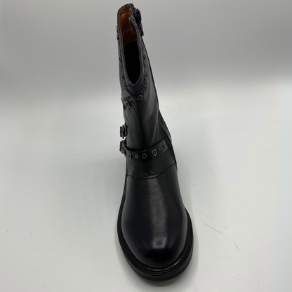 Black leather boot with buckle details on a white background