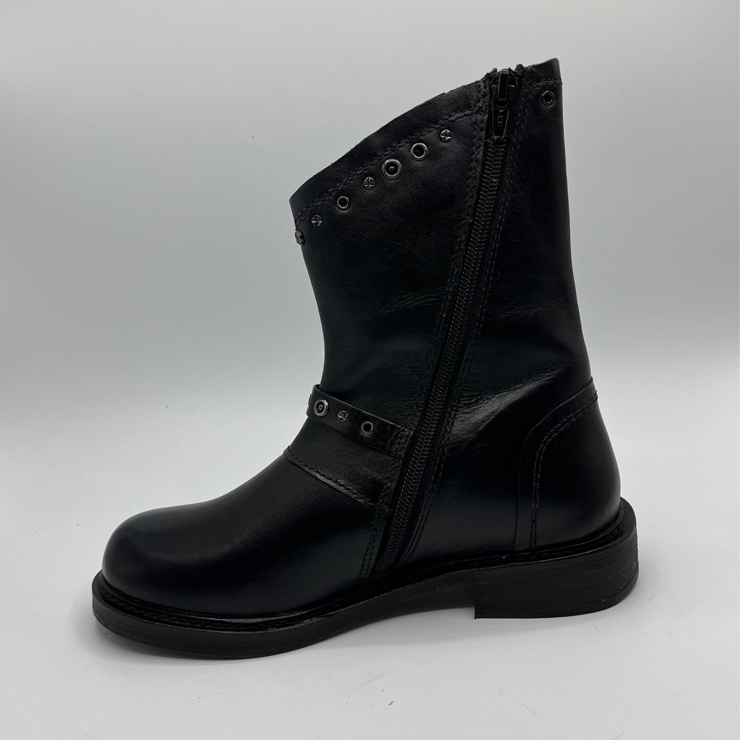 Black leather boot with a zipper on a white background