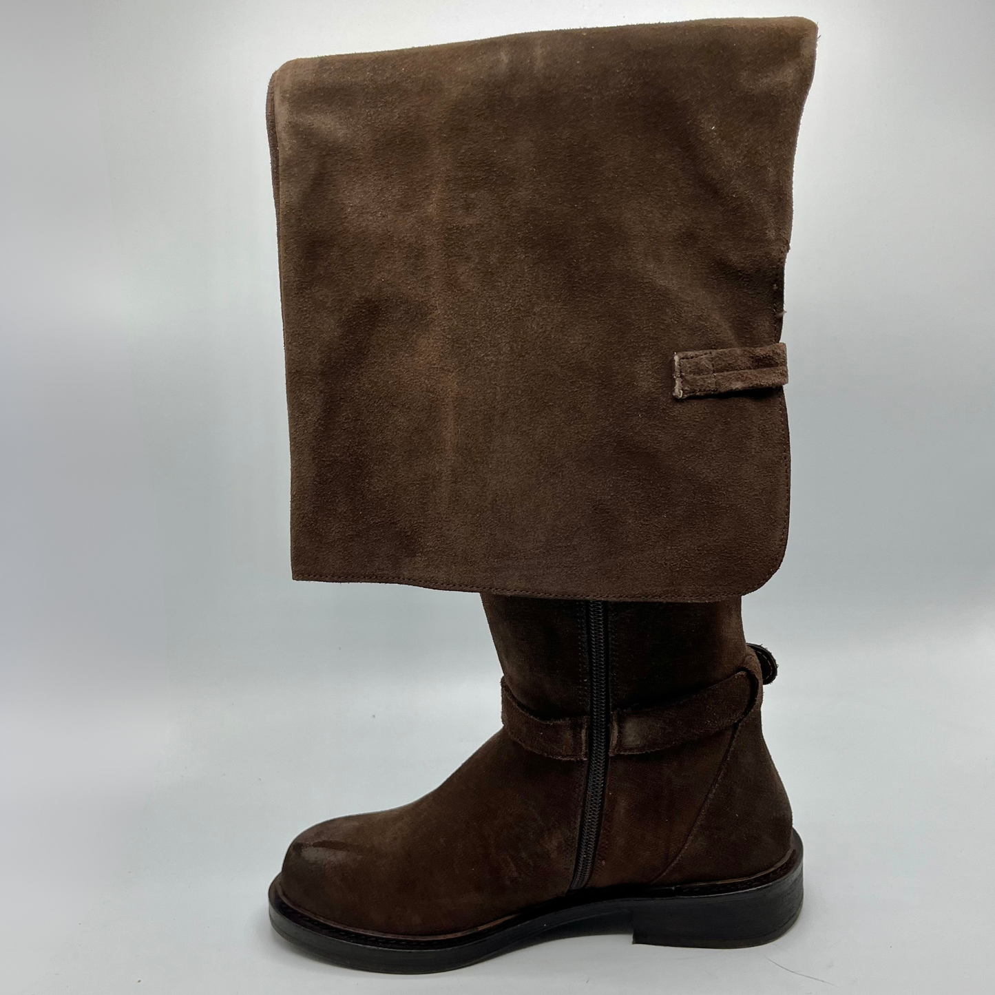Brown suede boot on a white background