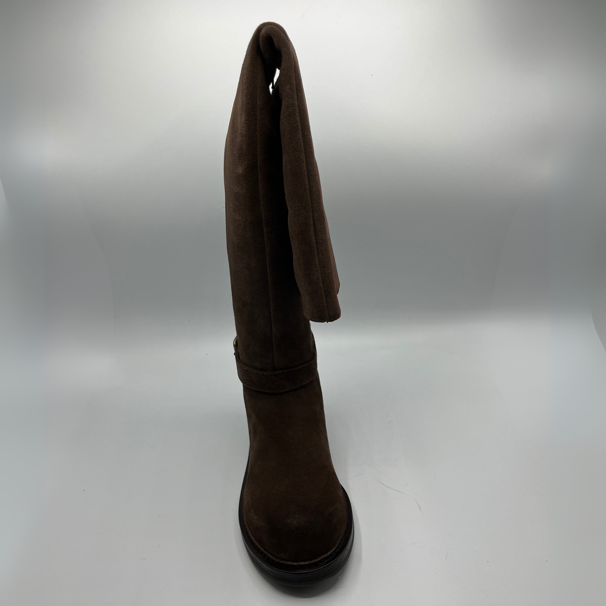 Brown over the knee-high boot on a white background