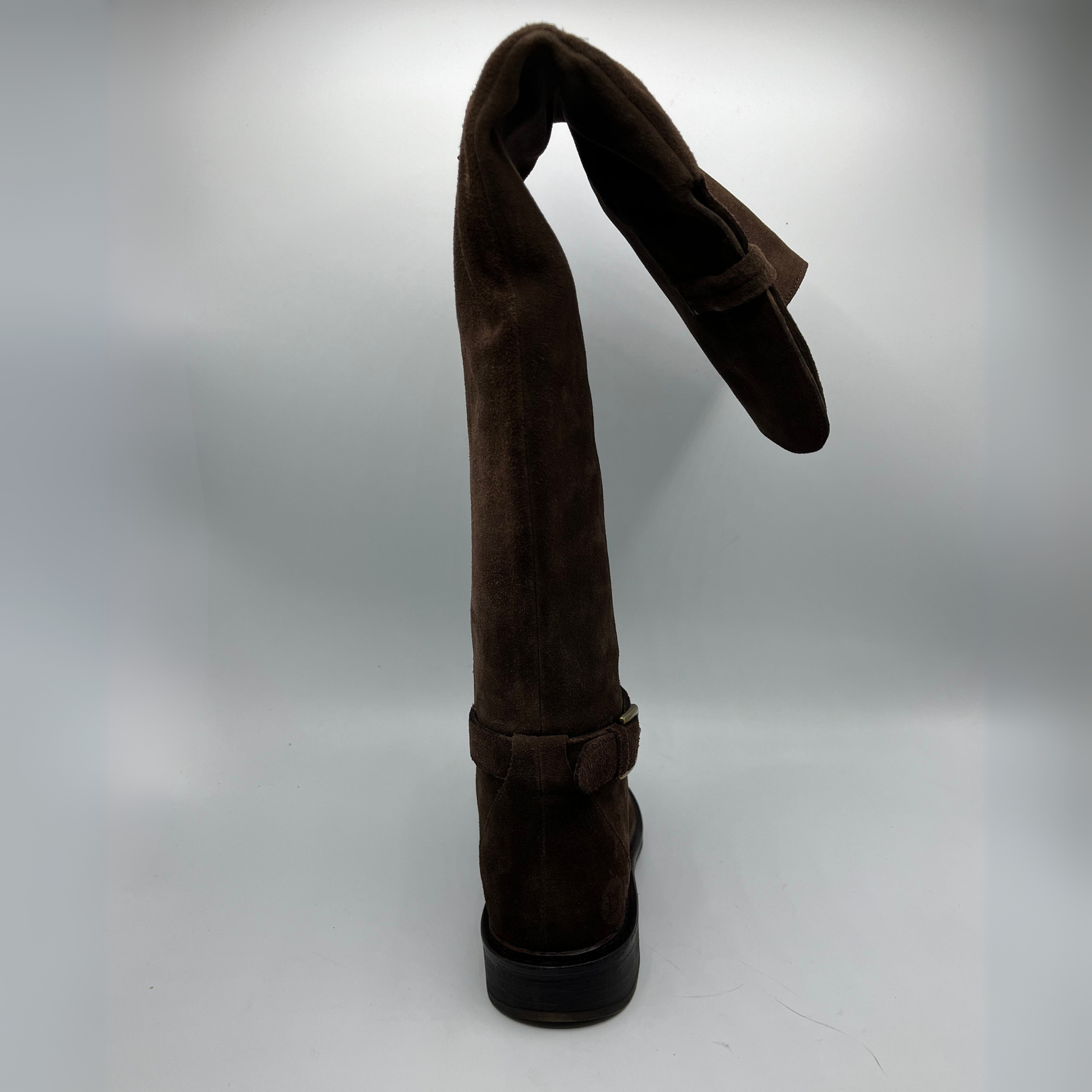 Brown suede boot on a white background
