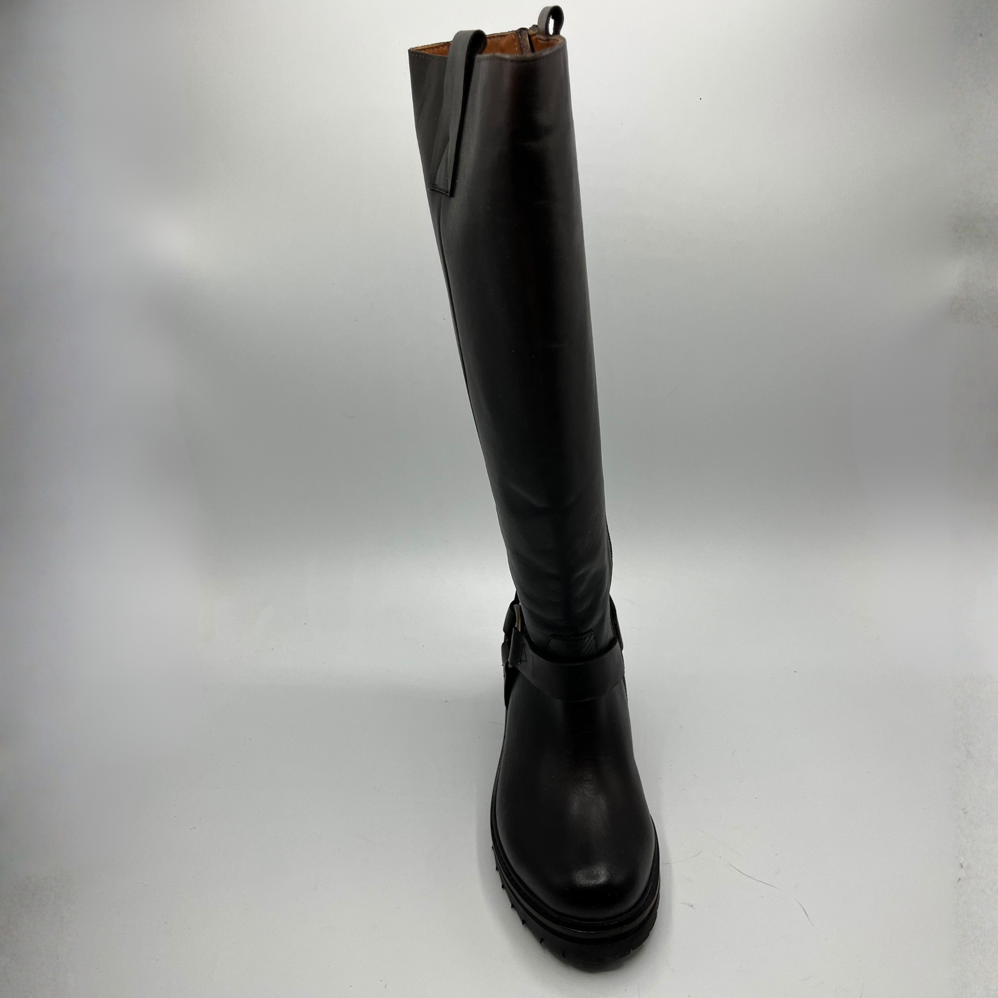 Black knee-high boot on a white background