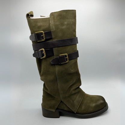 Green boot with multiple straps and buckles on a white background