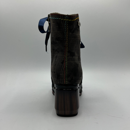 Boot with a block heel on a gray background